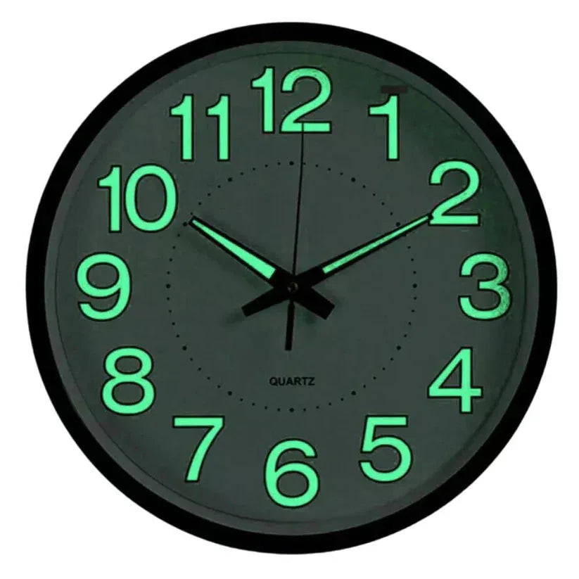 Glowing green wall clock with black frame on a white background