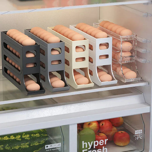 Egg storage containers on a refrigerator shelf with apples in the background.