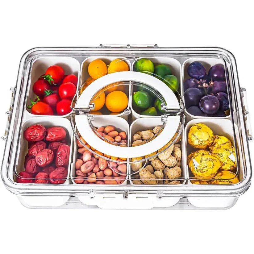 Multicolored snacks in a compartmentalized container on a white background