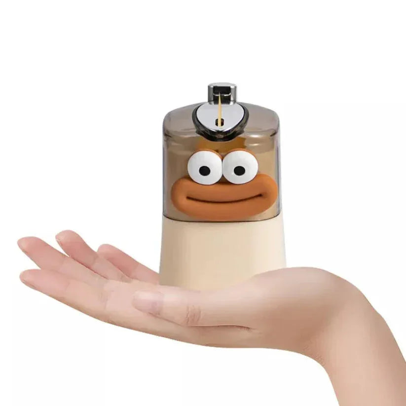 Perfume bottle with cartoon face held in a hand against a white background