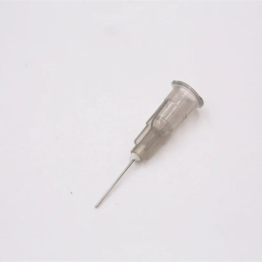 Small metal needle on a white background