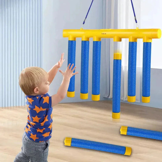 Child playing with a blue and yellow climbing toy indoors.