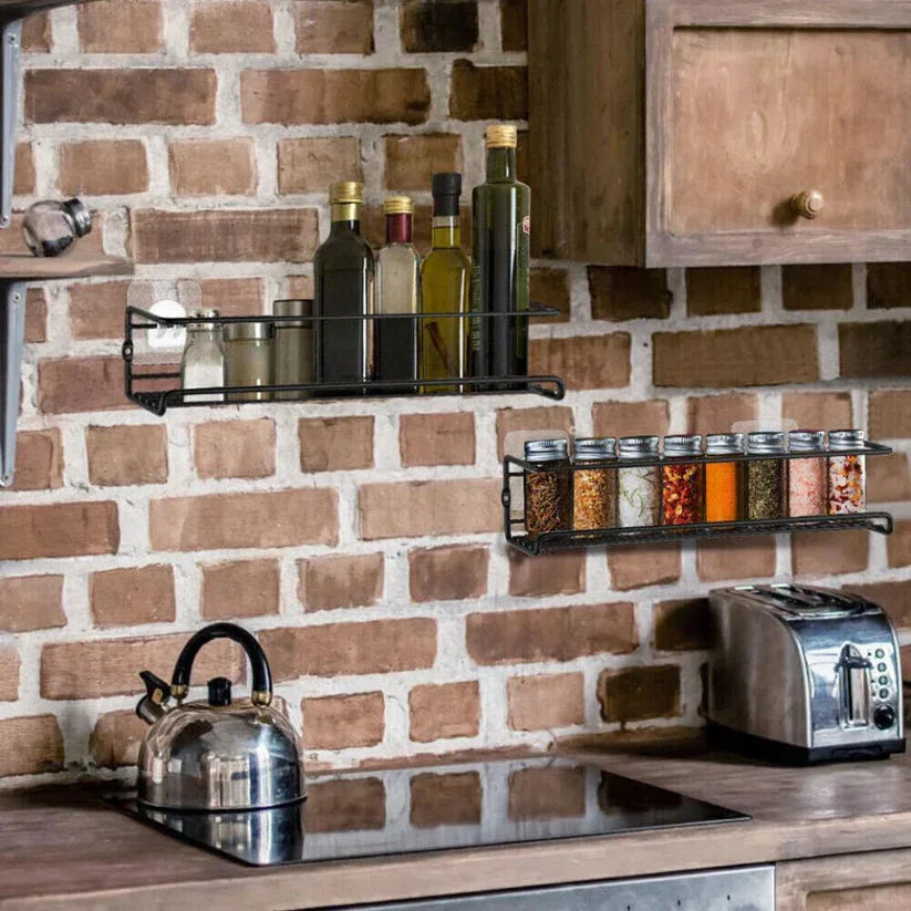 Kitchen with brick wall, spice racks, and toaster.
