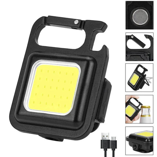 Black LED work light with USB cable on a white background