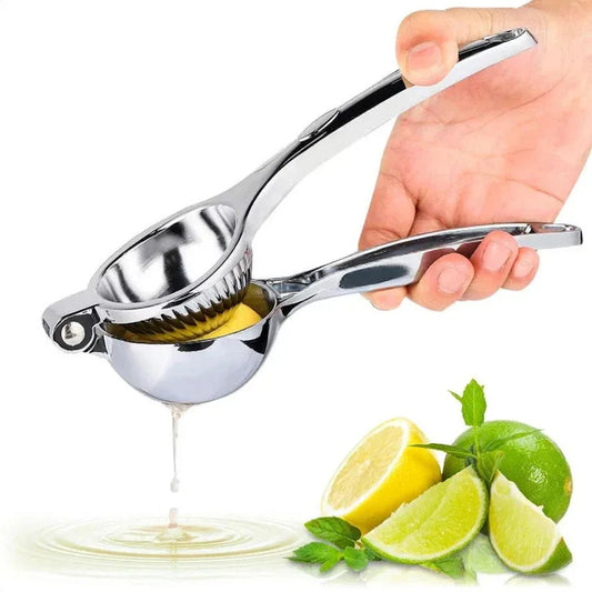 Hand using a metal lemon squeezer with lemons and limes on a white background