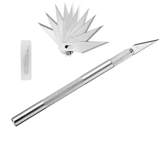 Metal craft knife with interchangeable blades on a white background