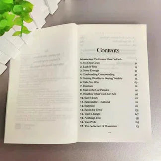 Open book with a table of contents on a light background