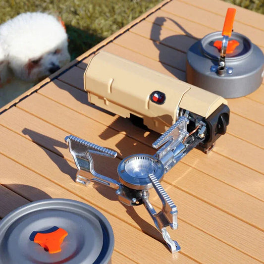 Portable camping stove on a wooden surface with a small dog in the background