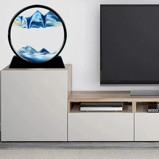 Modern living room with a TV and decorative circular piece on a stand.