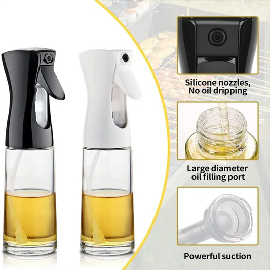 Two glass oil sprayers with black and white nozzles, filled with oil, on a light gray background.