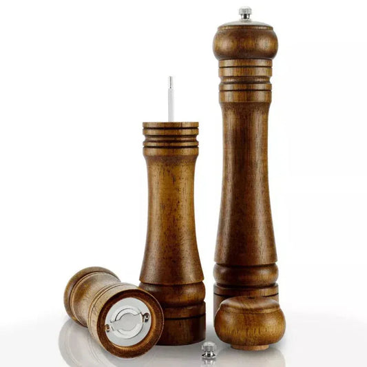 Set of wooden salt and pepper shakers on a white background