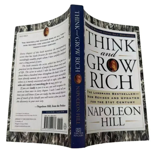 Book titled 'Think and Grow Rich' by Napoleon Hill on a white background