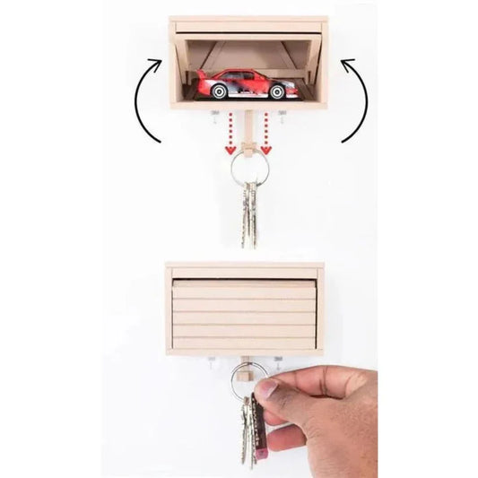 Key holder with a small compartment for storing items, shown with keys attached.
