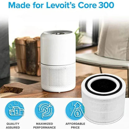 Levoit Core 300 air purifier with filter on a wooden surface, surrounded by home decor elements.

