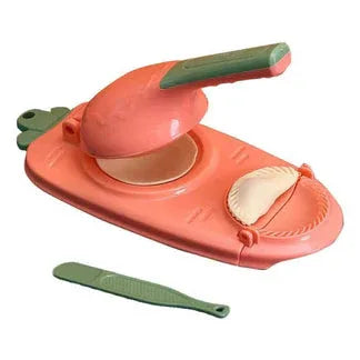 Carrot-shaped orange and green kitchen tool with a strap on a white background

