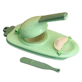 Green kitchen tool with a bowl and handle on a white background

