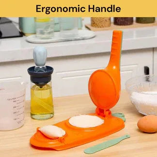 Orange kitchen tool with a bottle of oil on a wooden surface

