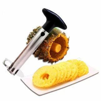 Pineapple corer with slices on a white background

