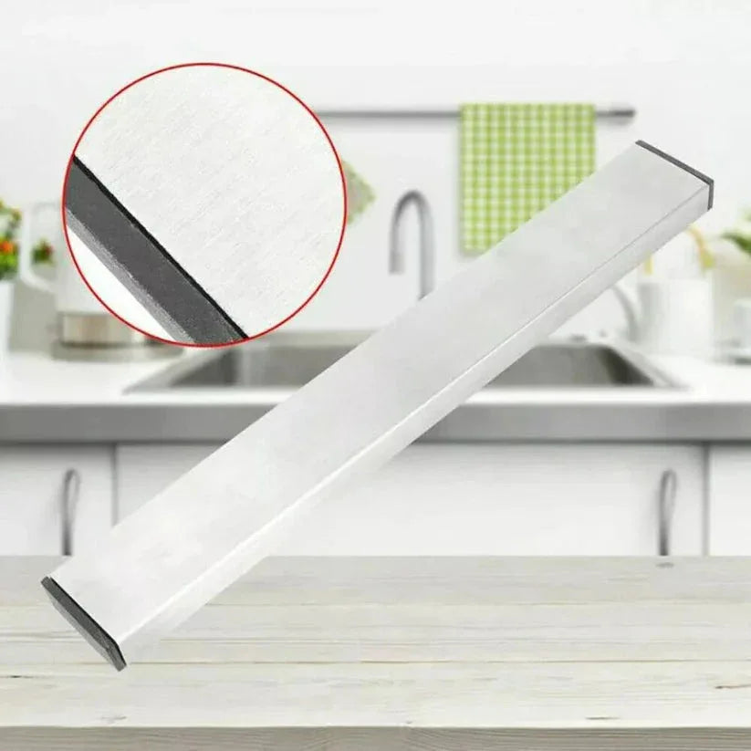 White kitchen sink strainer with a close-up inset on a kitchen counter.

