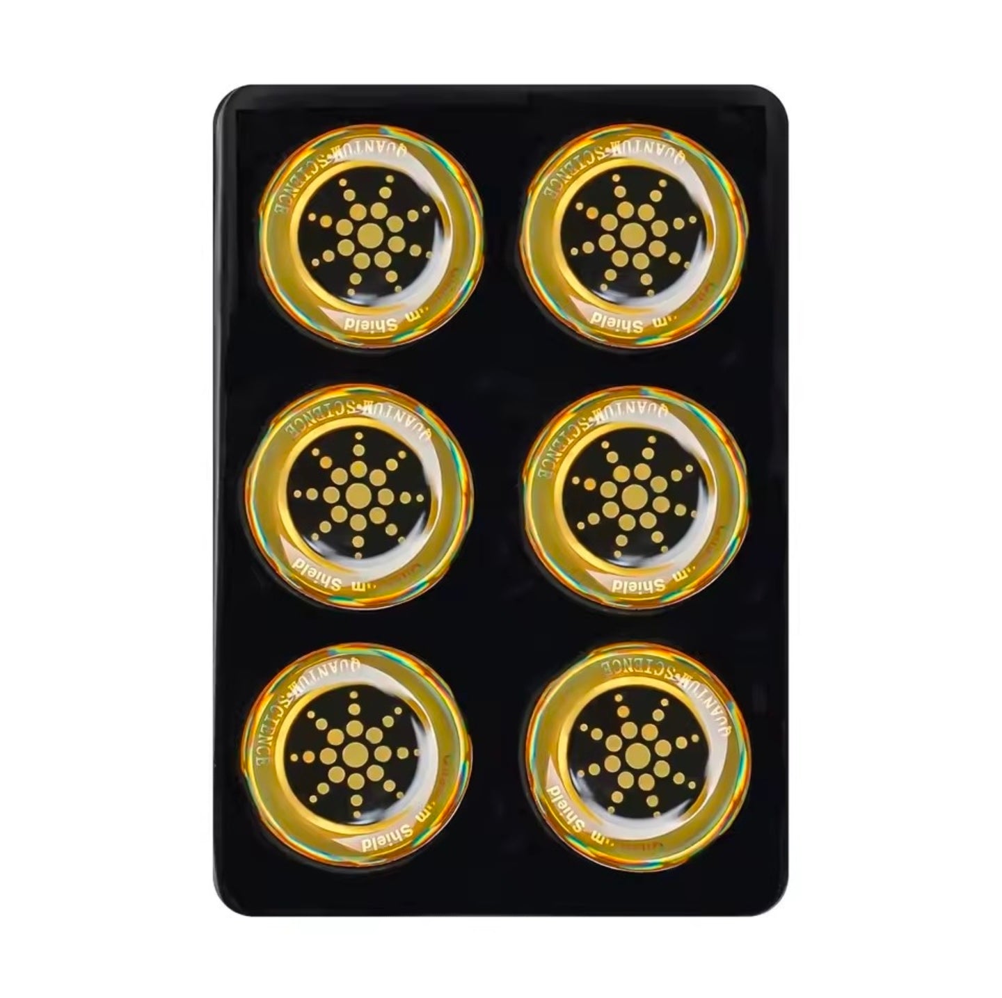 Set of six gold and black circular objects on a black card

