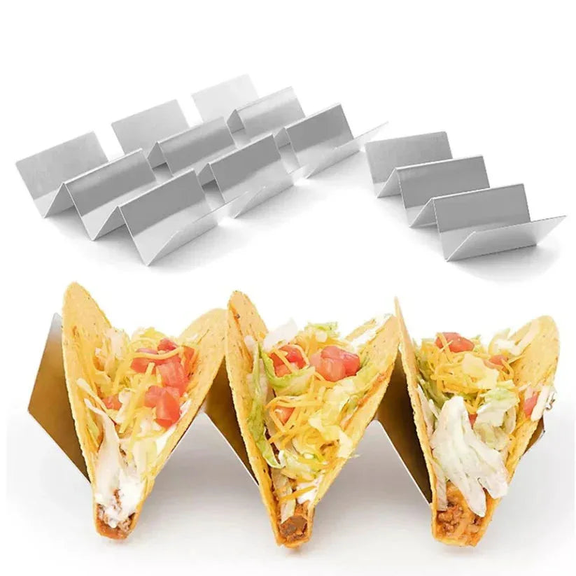 Metal taco holders with three filled tacos on a white background

