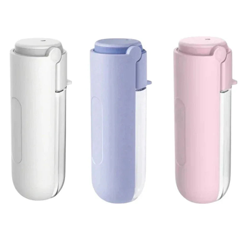 Three travel mugs in white, light blue, and pink on a white background

