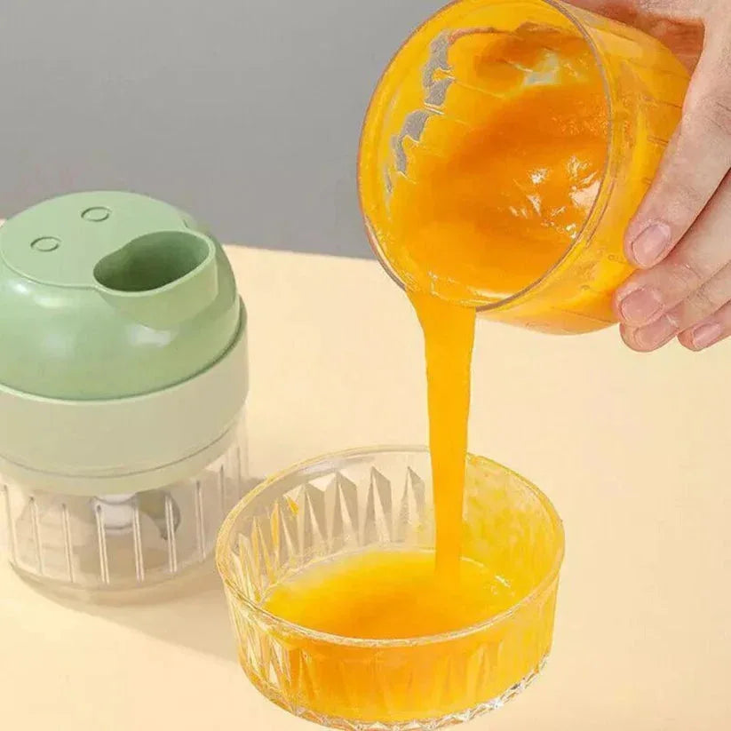 Orange juice being poured from a container into a glass with a green juicer in the background.

