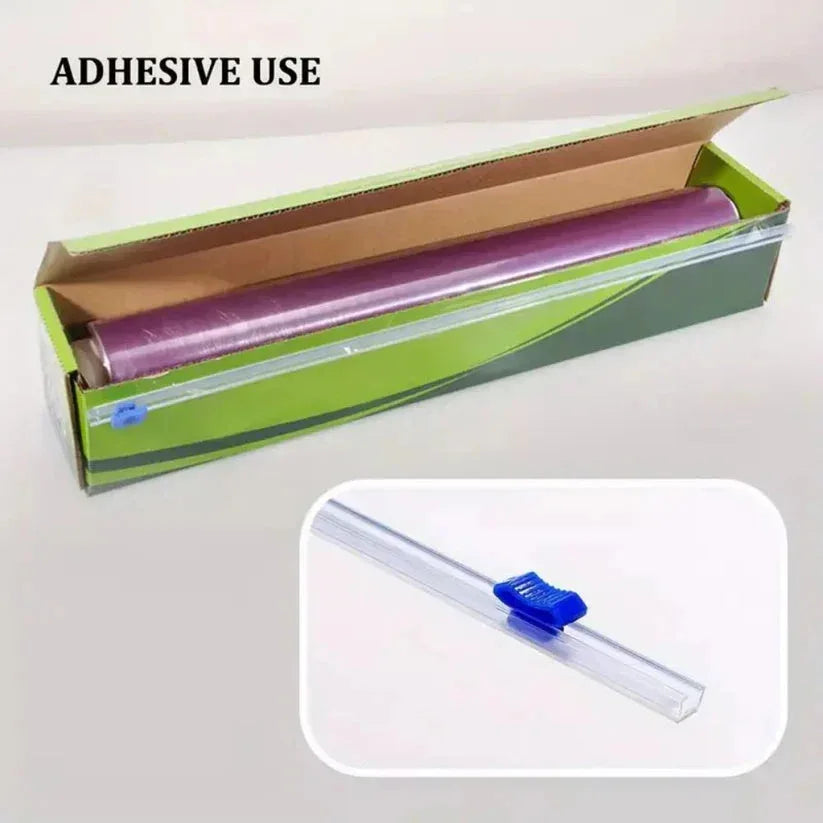 Roll of adhesive material in a green box with a close-up of the adhesive tool on a white background.

