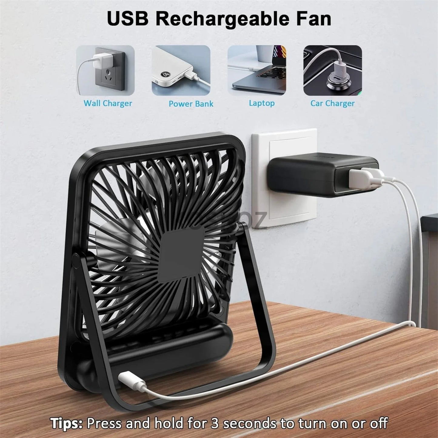 Black USB rechargeable fan on a wooden surface with charging options displayed.


