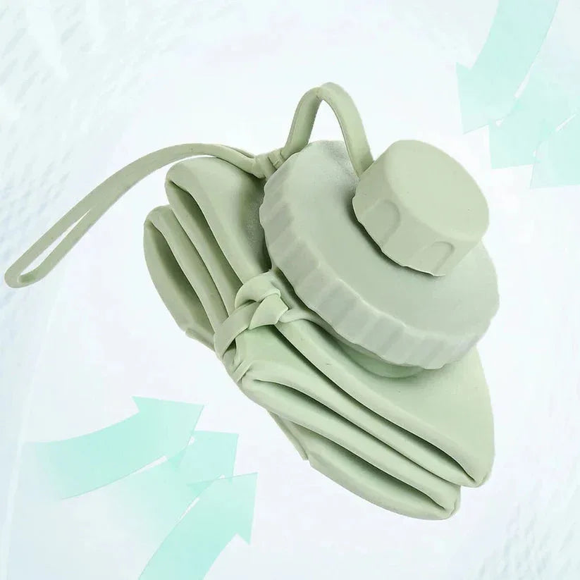 Light green silicone face mask with a strap on a light blue gradient background

