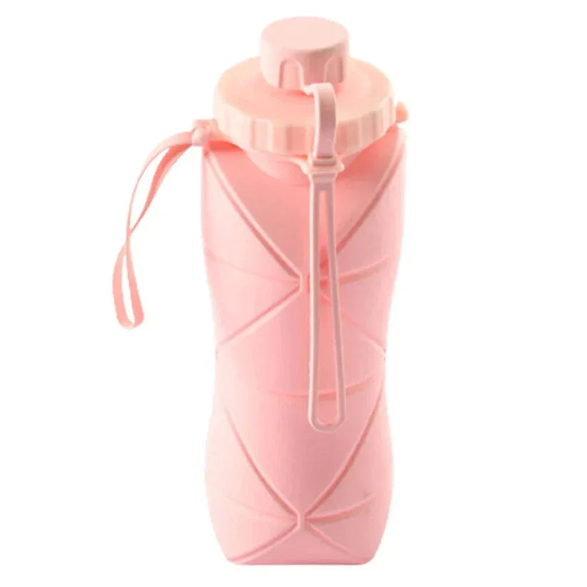 Pink silicone water bottle with a strap on a white background

