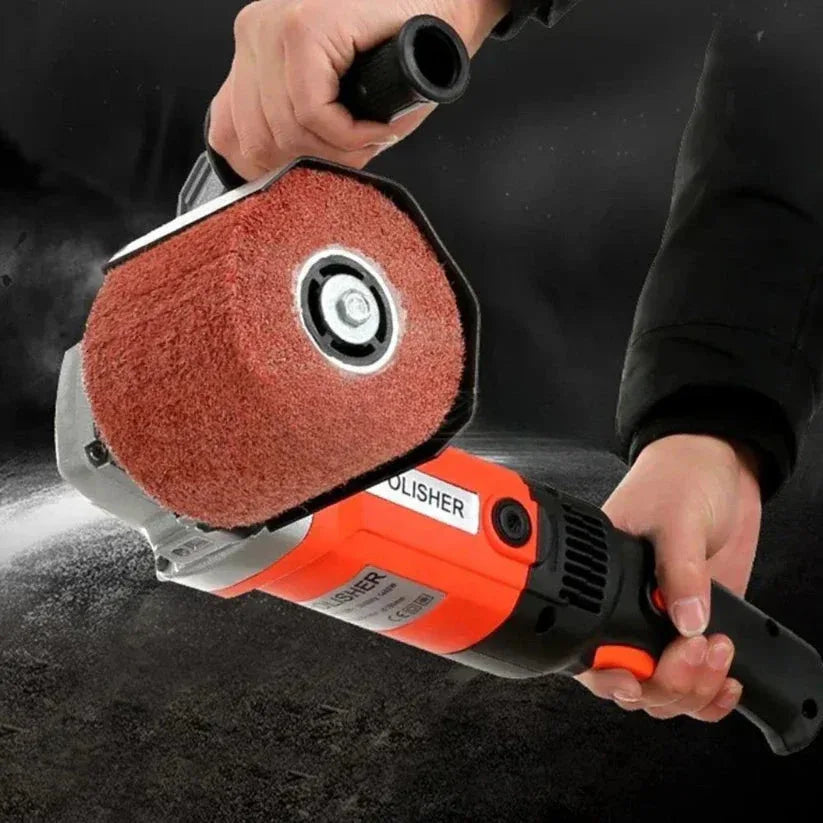 Person holding a polisher with a red sanding disc on a dark background

