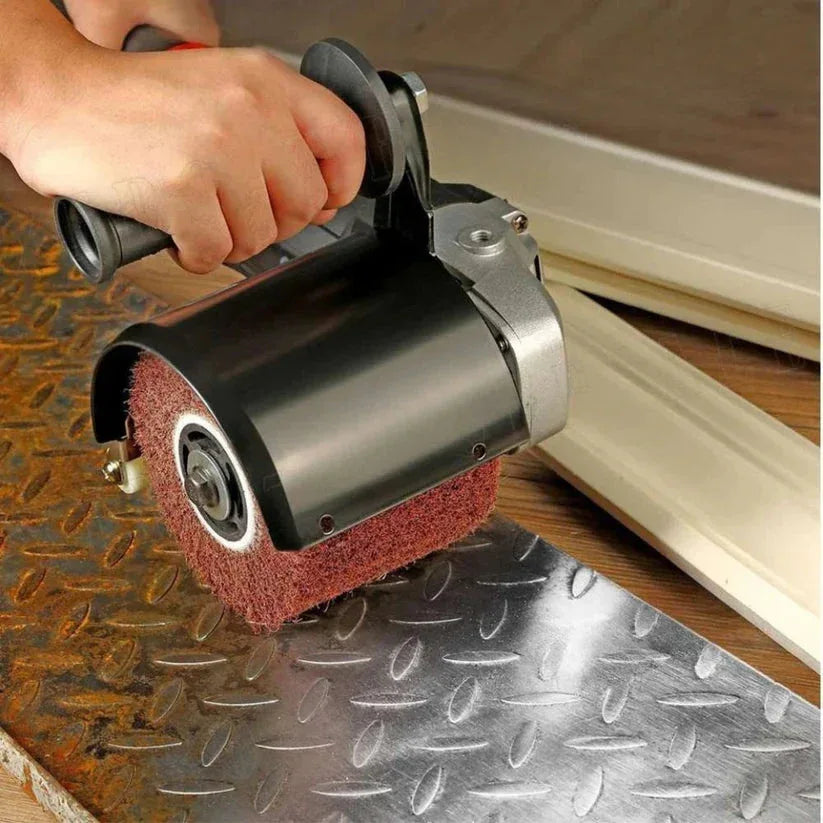 Hand using a belt sander on metal surface

