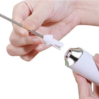 Close-up of a hand holding a white electronic device with a metal component.

