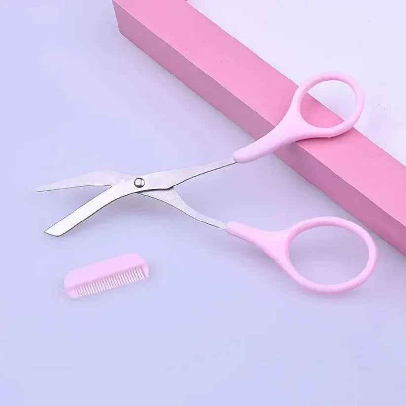 Pink scissors and comb set on a light purple background

