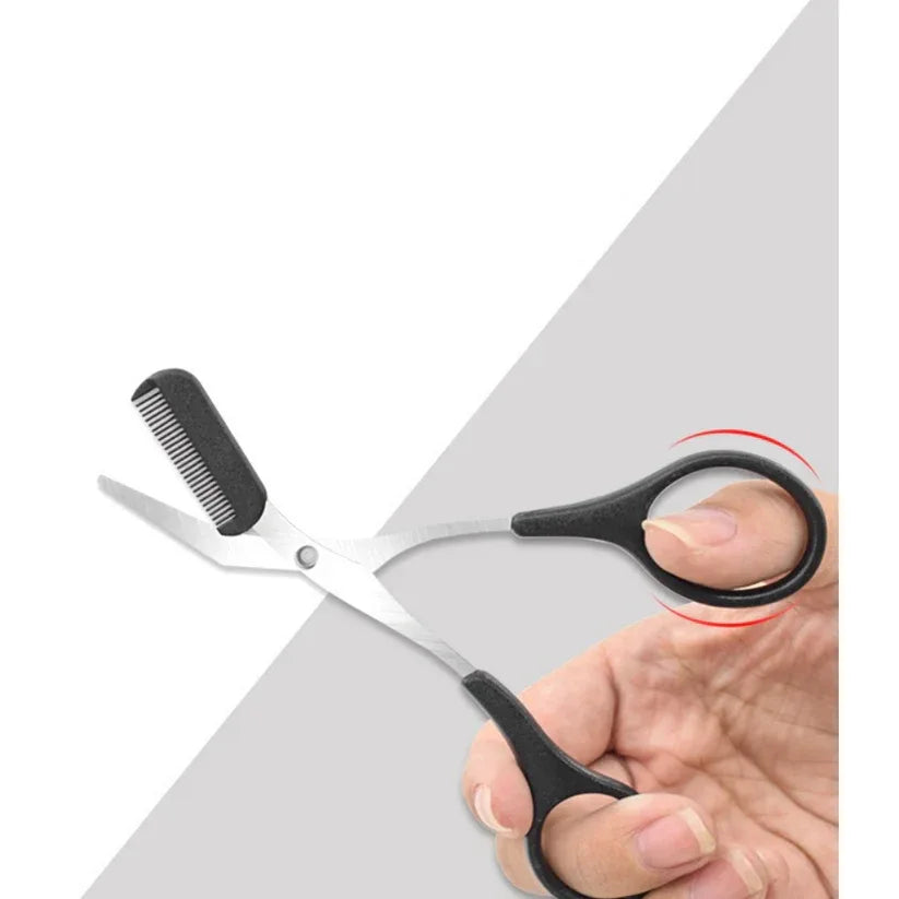Hair cutting shears with a comb held by a hand on a white background

