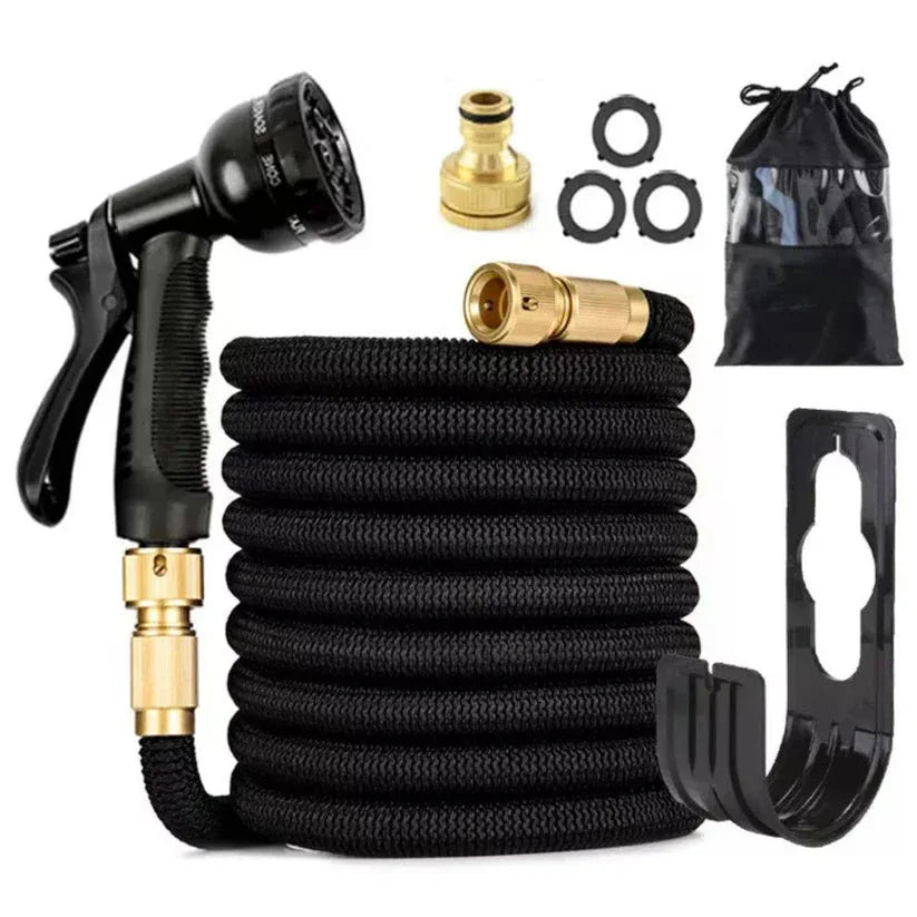 Black and gold garden hose set with various connectors and a storage bag on a white background

