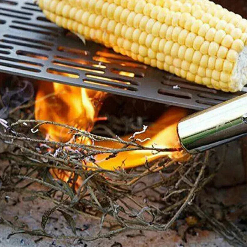 Corn on the cob being grilled over an open flame with a metal grate.

