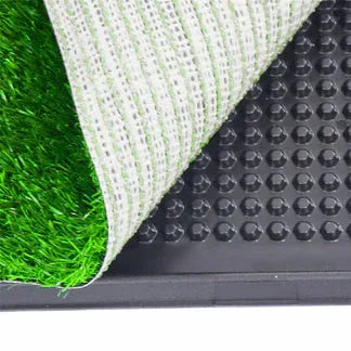 Close-up of a doormat with grass-like texture, mesh, and textured surface.

