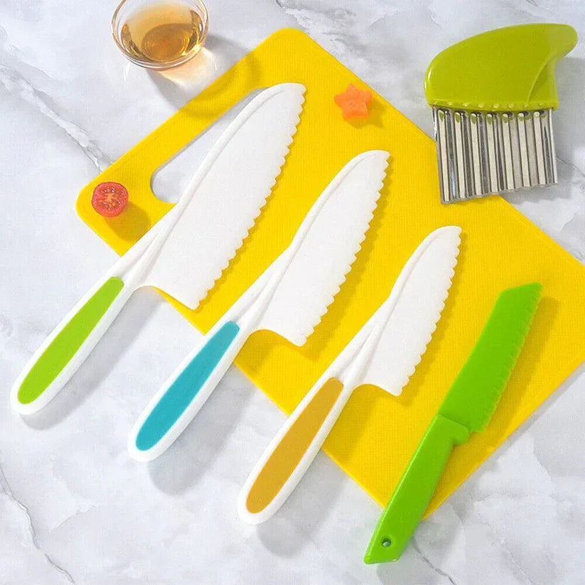 Set of colorful knives and a brush on a yellow cutting board with a white background.

