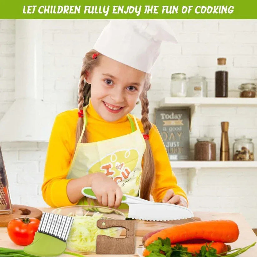 Child in a kitchen with cooking utensils and vegetables, wearing a chef's hat and apron.

