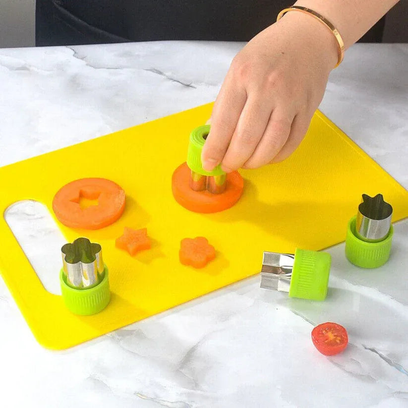 Person using a vegetable peeler on carrots with various shaped attachments on a yellow cutting board.

