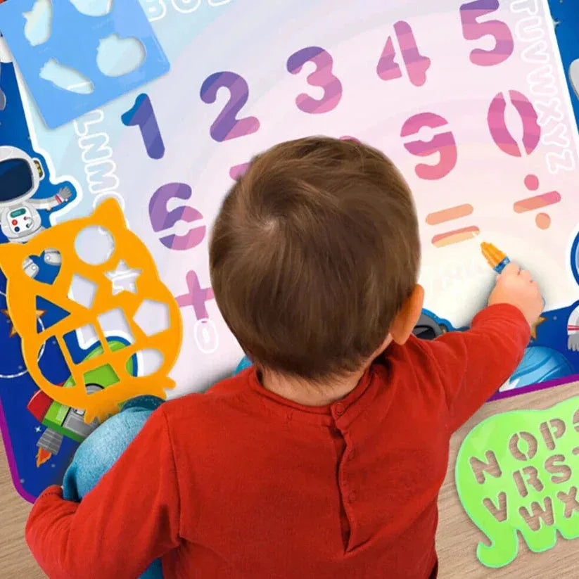 Child playing with educational number and letter mats

