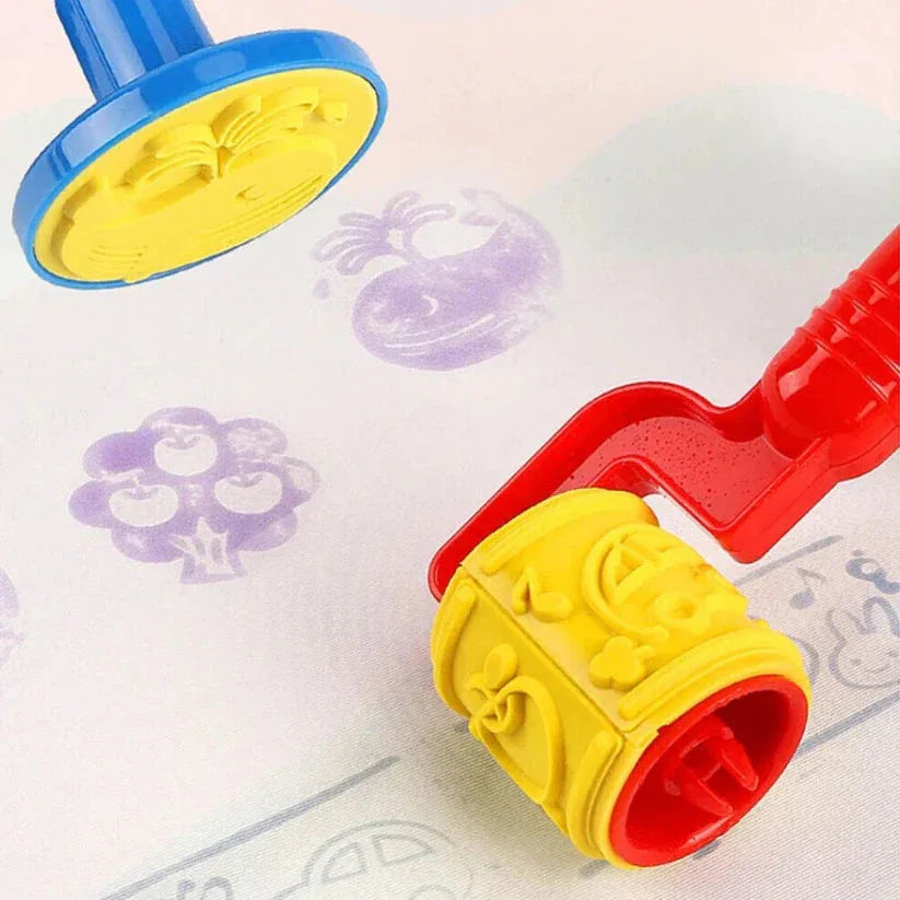 Colorful plastic stamps on a paper with printed designs.

