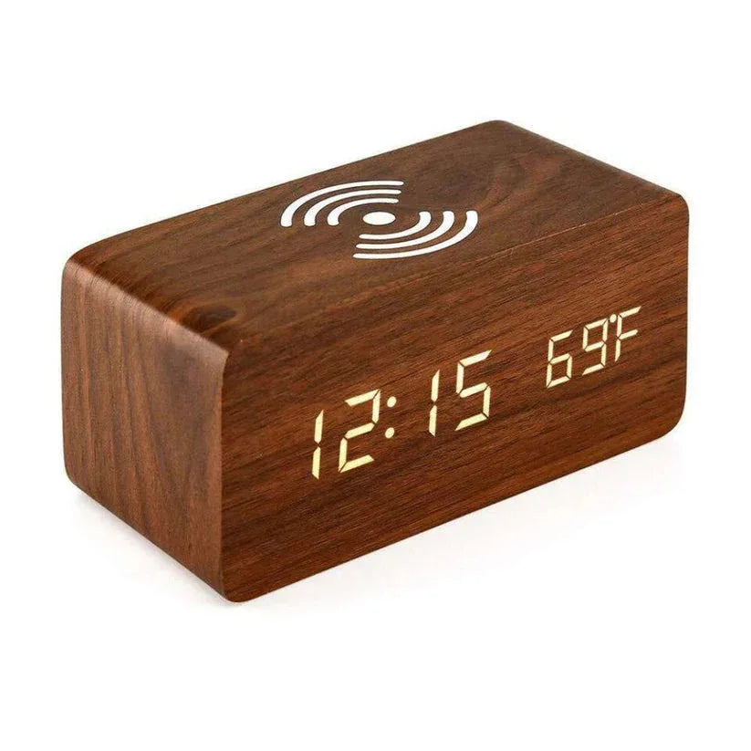Wooden digital clock with LED display on a white background

