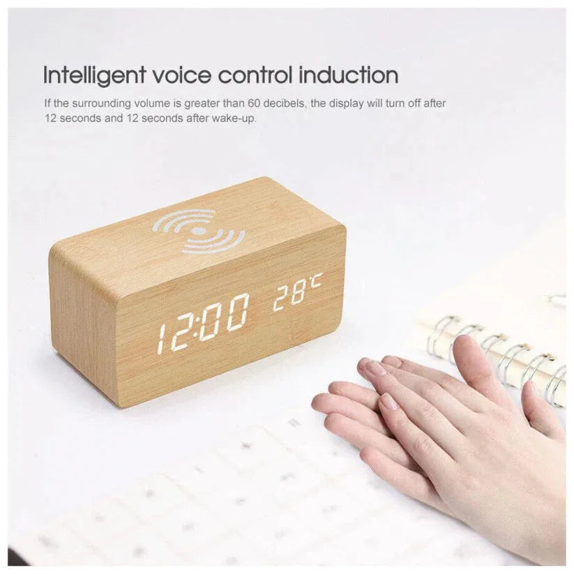 Wooden digital clock with LED display on a white surface, featuring intelligent voice control induction.

