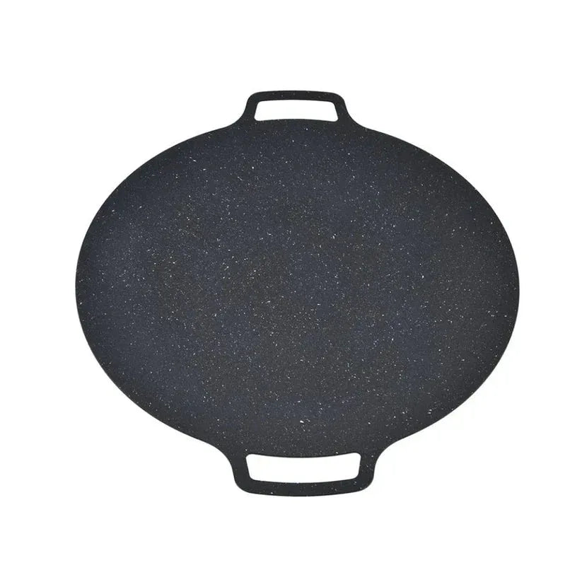 Black frying pan with speckled pattern on a white background

