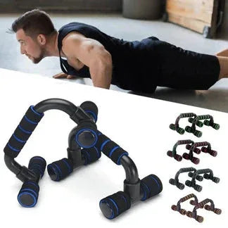 Man doing push-ups with a black and blue resistance band on a white surface.


