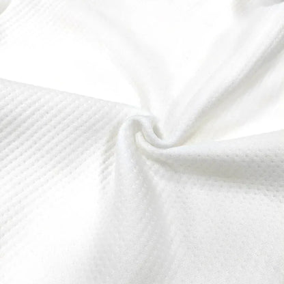 Close-up of white textured fabric

