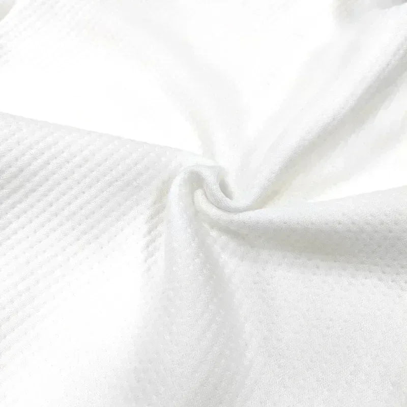 Close-up of white fabric with a subtle pattern

